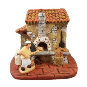 Santon de boulanger provençal enfournant une fougasse dans un four à bois traditionnel